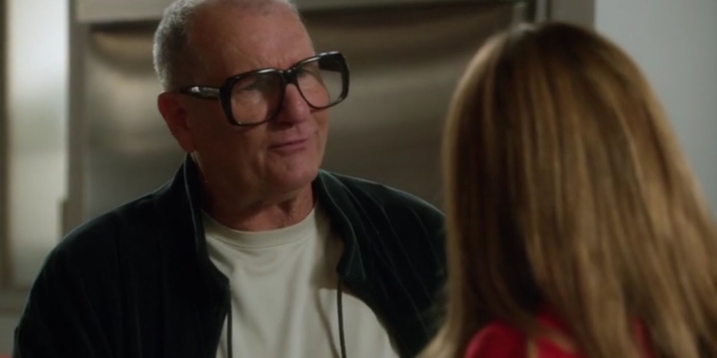 Jays wearing his new glasses while talking to Gloria on Modern Family