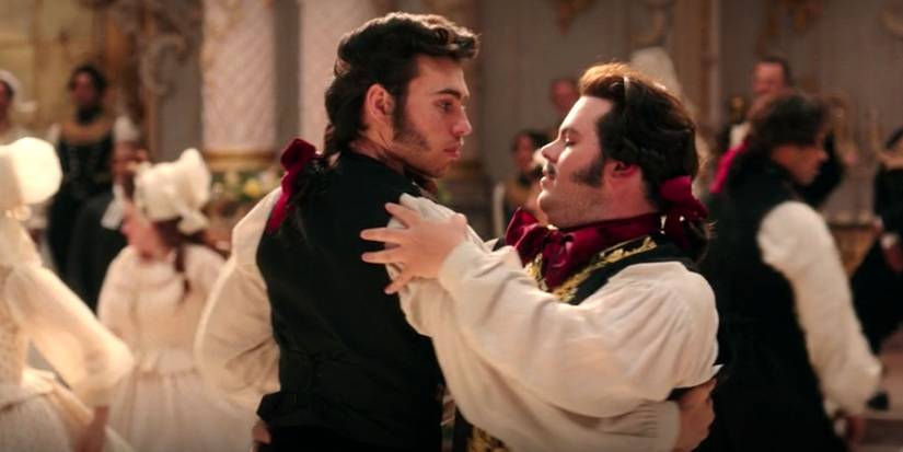Lefou dancing with a man in Beauty and the Beast
