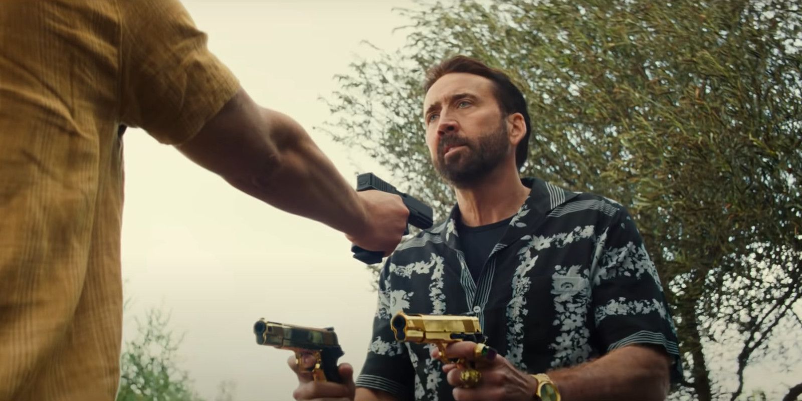 Nicolas Cage golden gun scene in The Unbearable Weight of Massive Talent