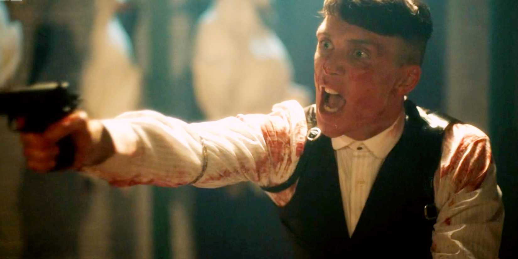 Tommy covered in blood pointing a gun in Peaky Blinders