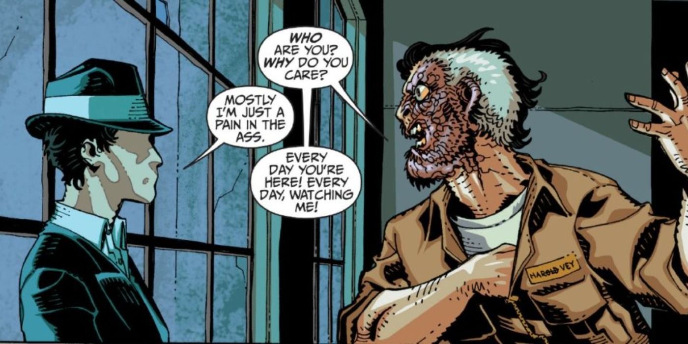 The Question confronts Two Face in DC Comics.
