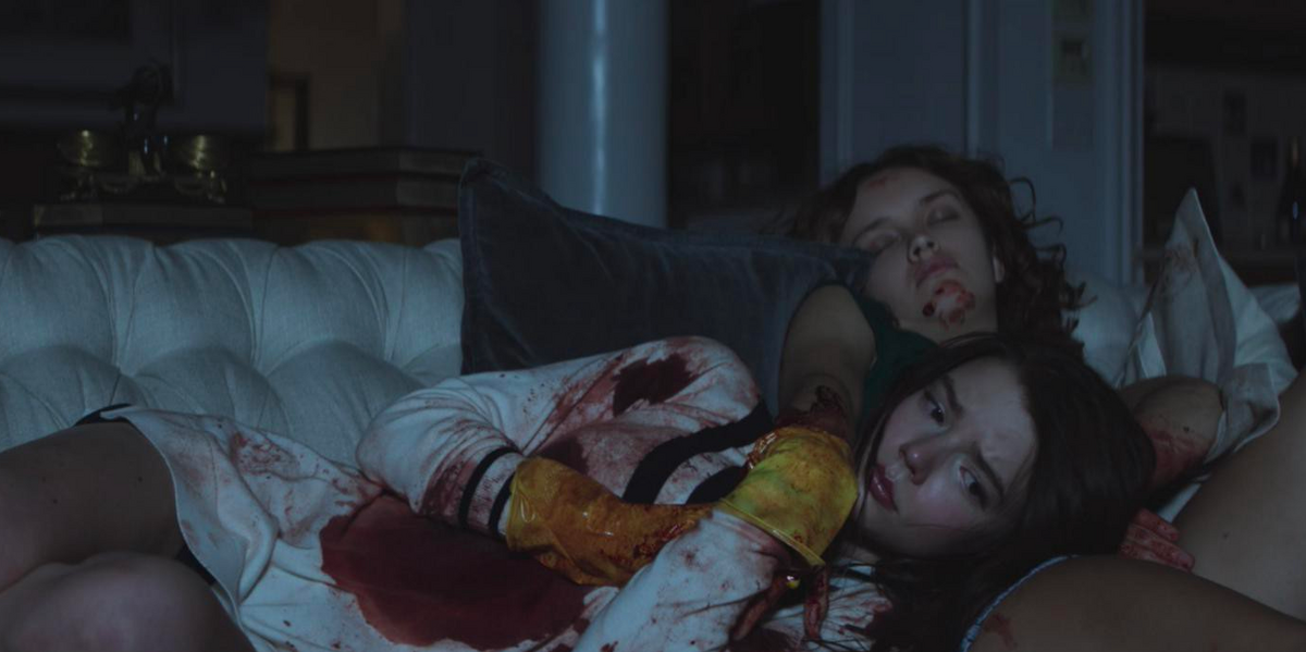 A bloody Lily lays on Amanda&rsquo;s lap in Thoroughbreds