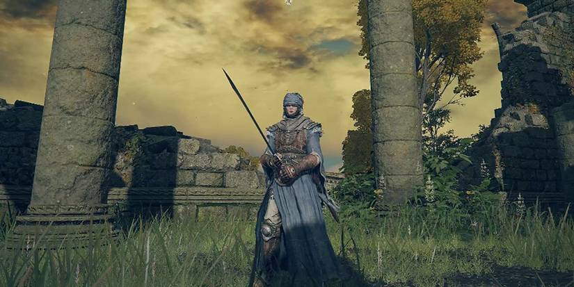 Warrior holds a sword in the field in Elden Ring
