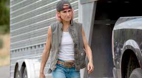 Teeter walks by a truck and trailer in Yellowstone.