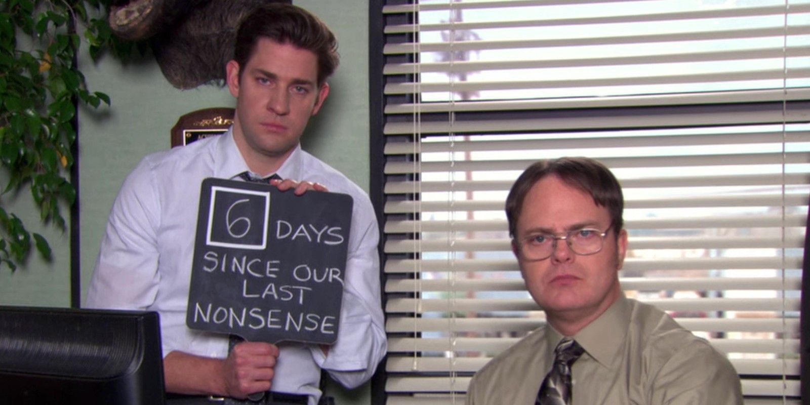 jim and dwight with nonsense sign in the office