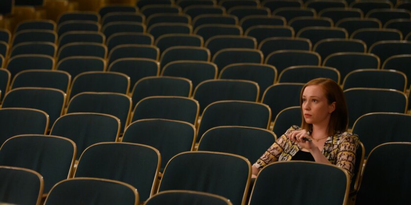 Ava sat in an empty theatre audience in Hacks