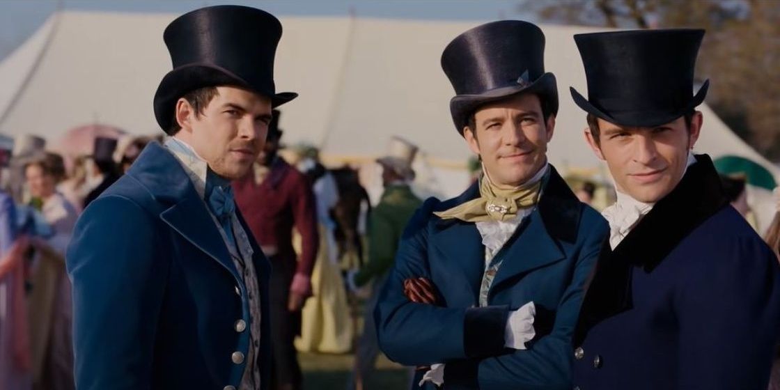 Anthony, Colin, and Benedict standing together wearing top hats at the horse race in Bridgerton season 2