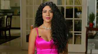 90 Day Fiance: Before the 90 Days Jasmine Pineda in pink dress, curly wig, smiling at Tell All