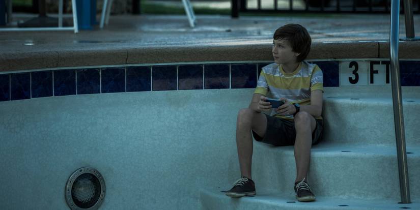 Jonah sitting in an empty pool in Ozark season 1.