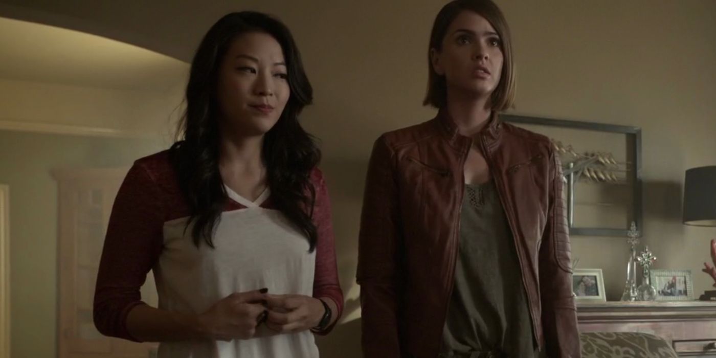 Kira and Malia discuss a plan in the McCall living room in Teen Wolf