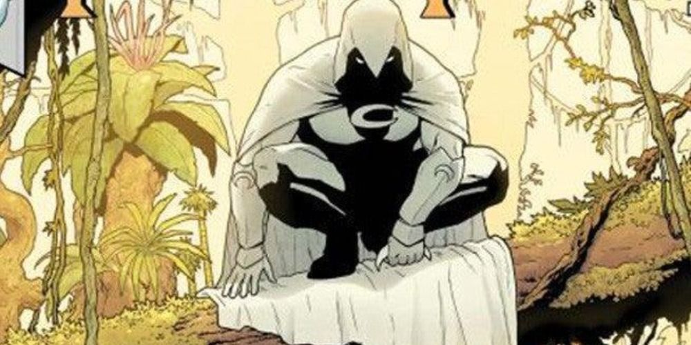 Moon Knight perched on a log in the Marvel comics