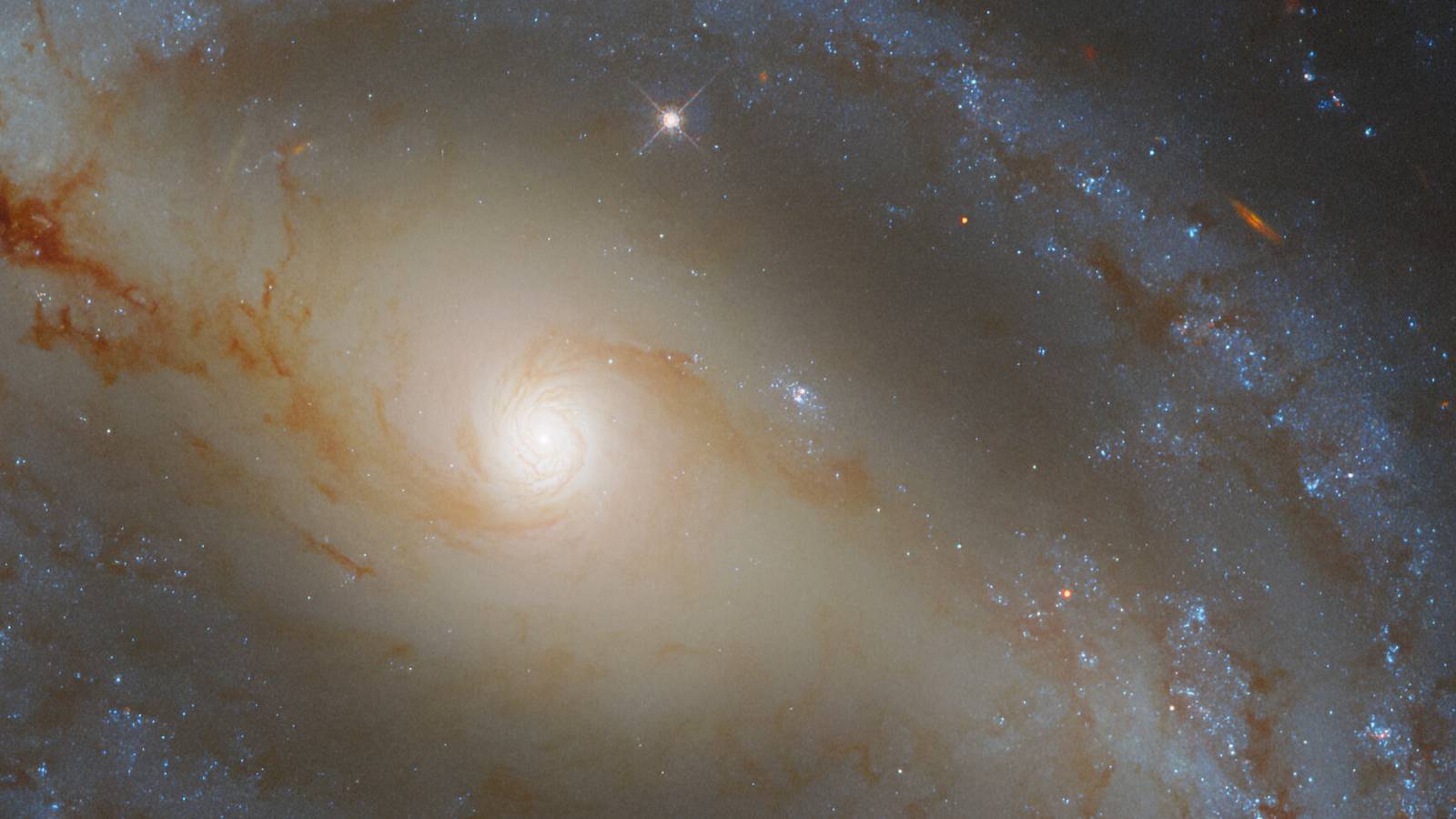 Hubble Spies On A Snake-Like Galaxy Slithering Through Space