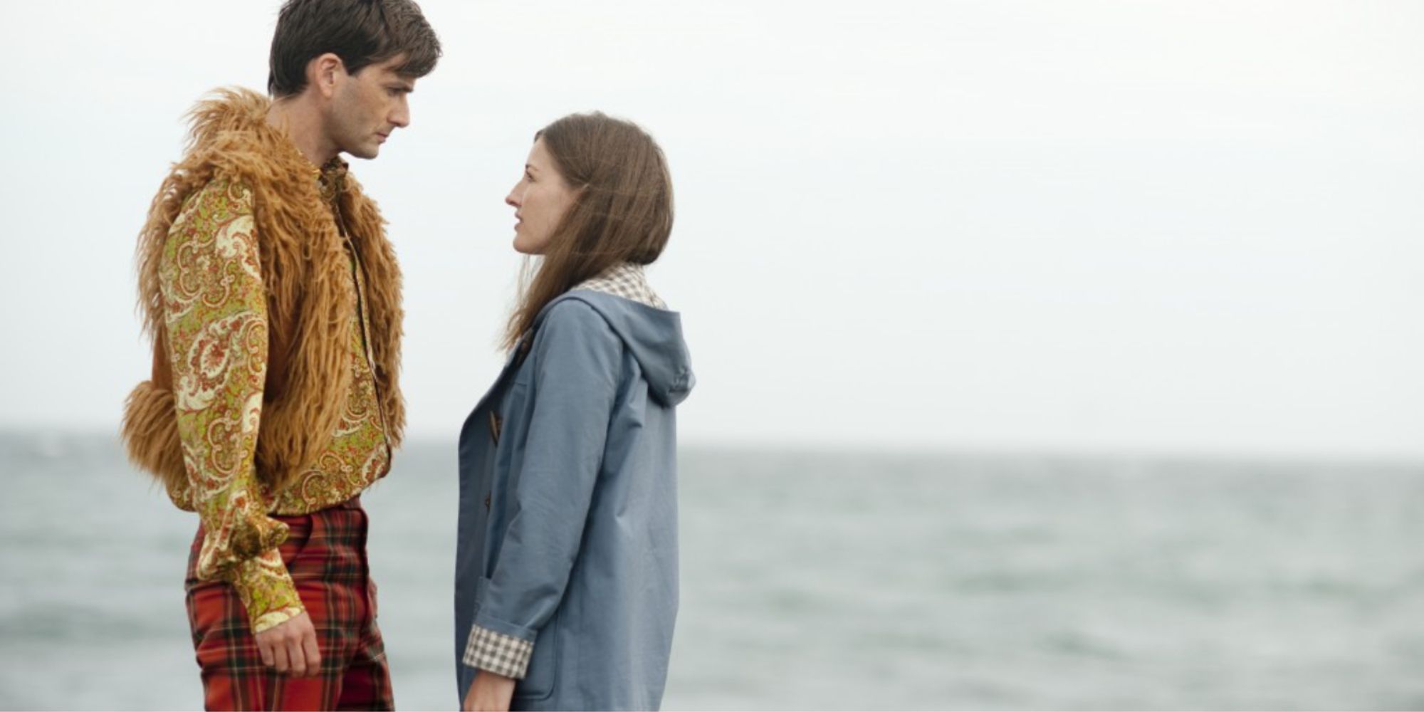 An image of David Tennant standing near the ocean in The Decoy Bride