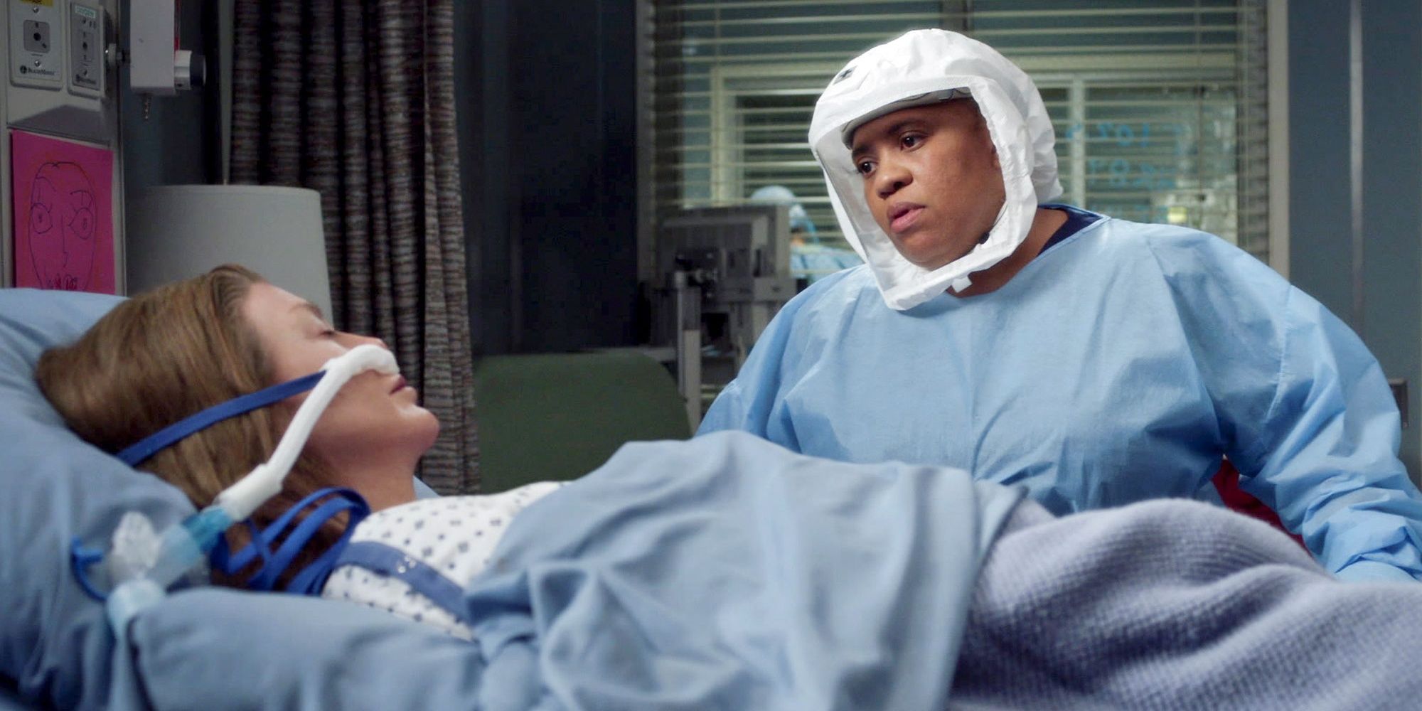 Bailey looking at Meredith in a hospital bed in Grey&rsquo;s Anatomy
