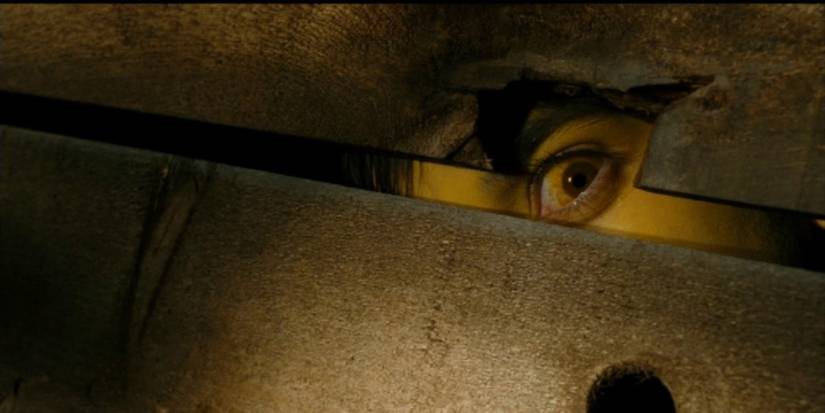 Billy peeks out at his victim in Black X-Mas.