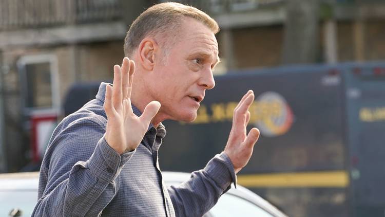 Jason Beghe as Hank Voight with his hands up speaking to someone in Chicago PD