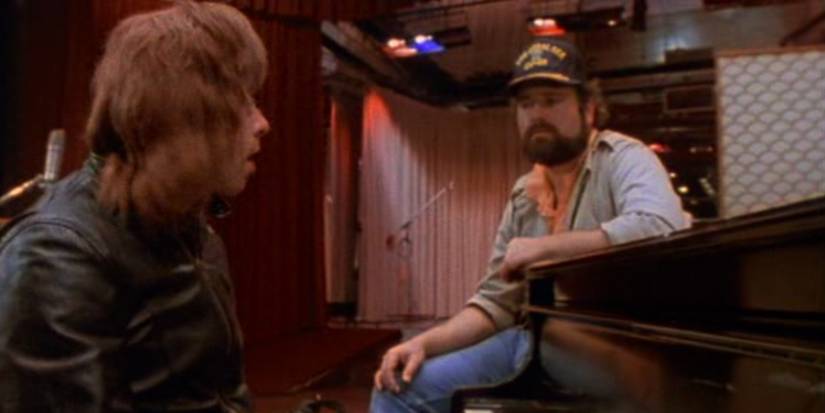 Christopher Guest as Nigel Tufnel and Rob Reiner as Marty Di Bergi in this is spinal tap