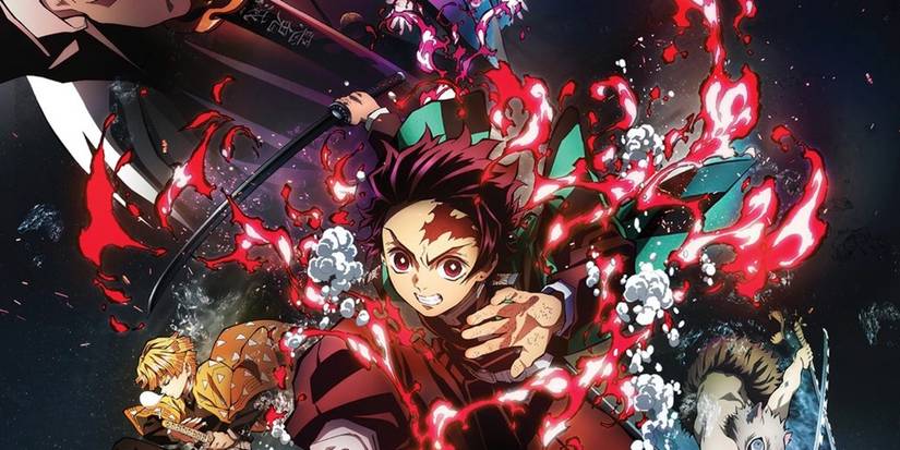  Mugen Train key art featuring Tanjiro leaping toward the camera surrounded by red flames alongside the main cast.