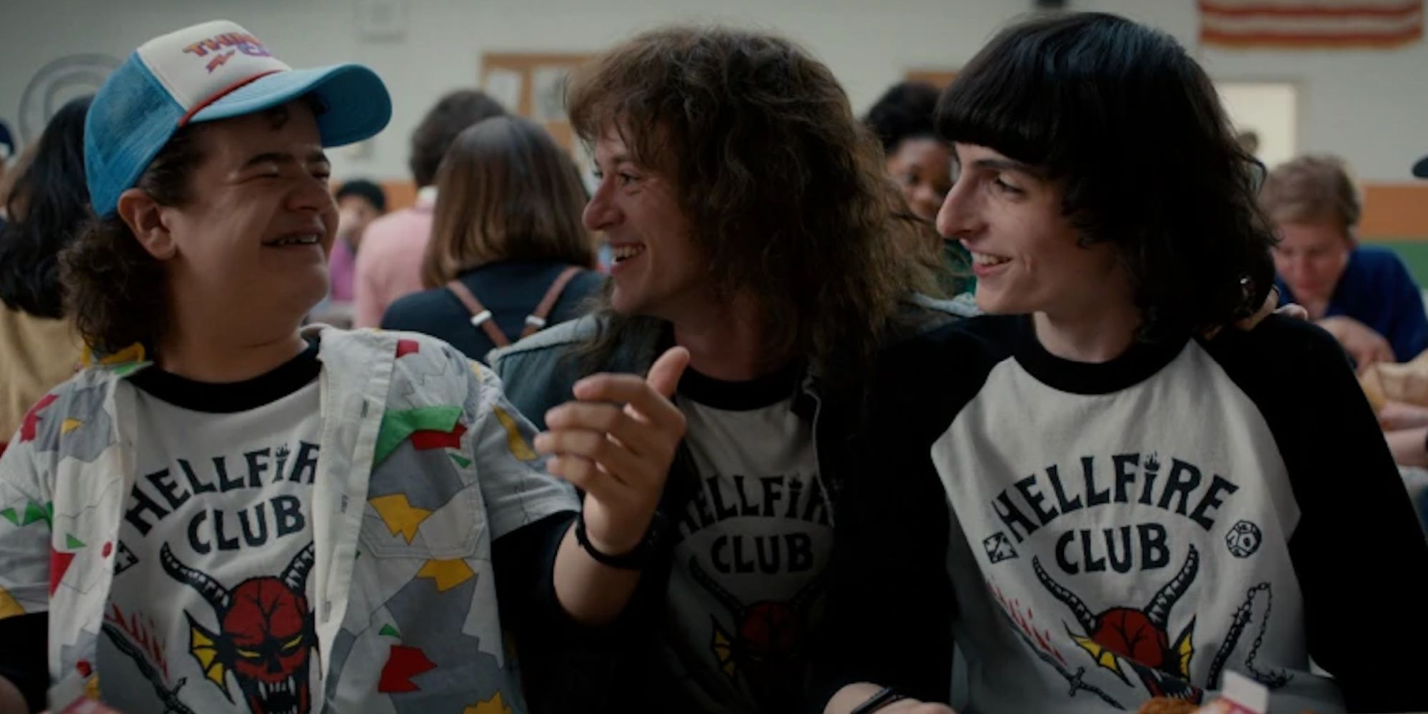 Dustin Eddie and Mike in the cafeteria on Stranger Things