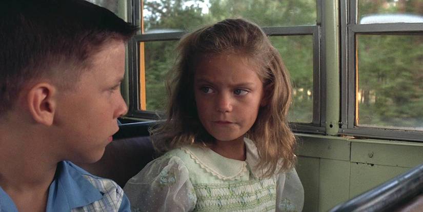 Forrest Gump and Jenny sitting next to each other on the bus in Forrest Gump