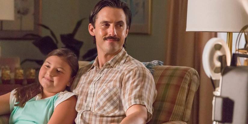 Jack Pearson sits with young Kate Pearson on the couch in This Is Us