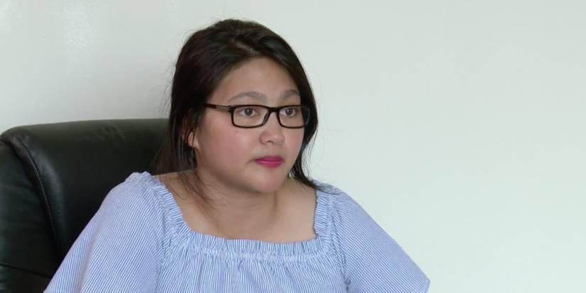 Leida Margaretha pale blue shirt wearing glasses