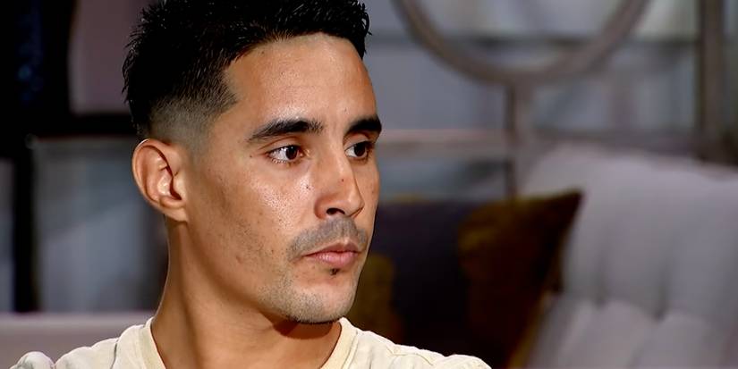Mohamed Jbali in 90 Day Fiance Season 2 looking away from camera wearing yellow shirt