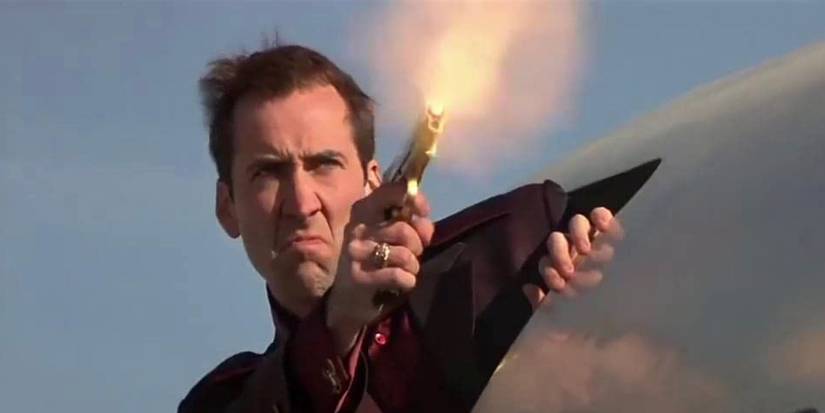 Castor Troy firing a gun in Face/Off