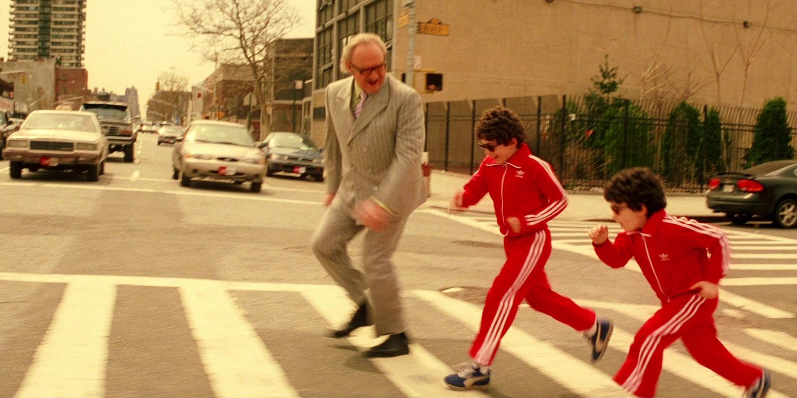 Royal runs across the street with Ari and Uzi in The Royal Tenenbaums