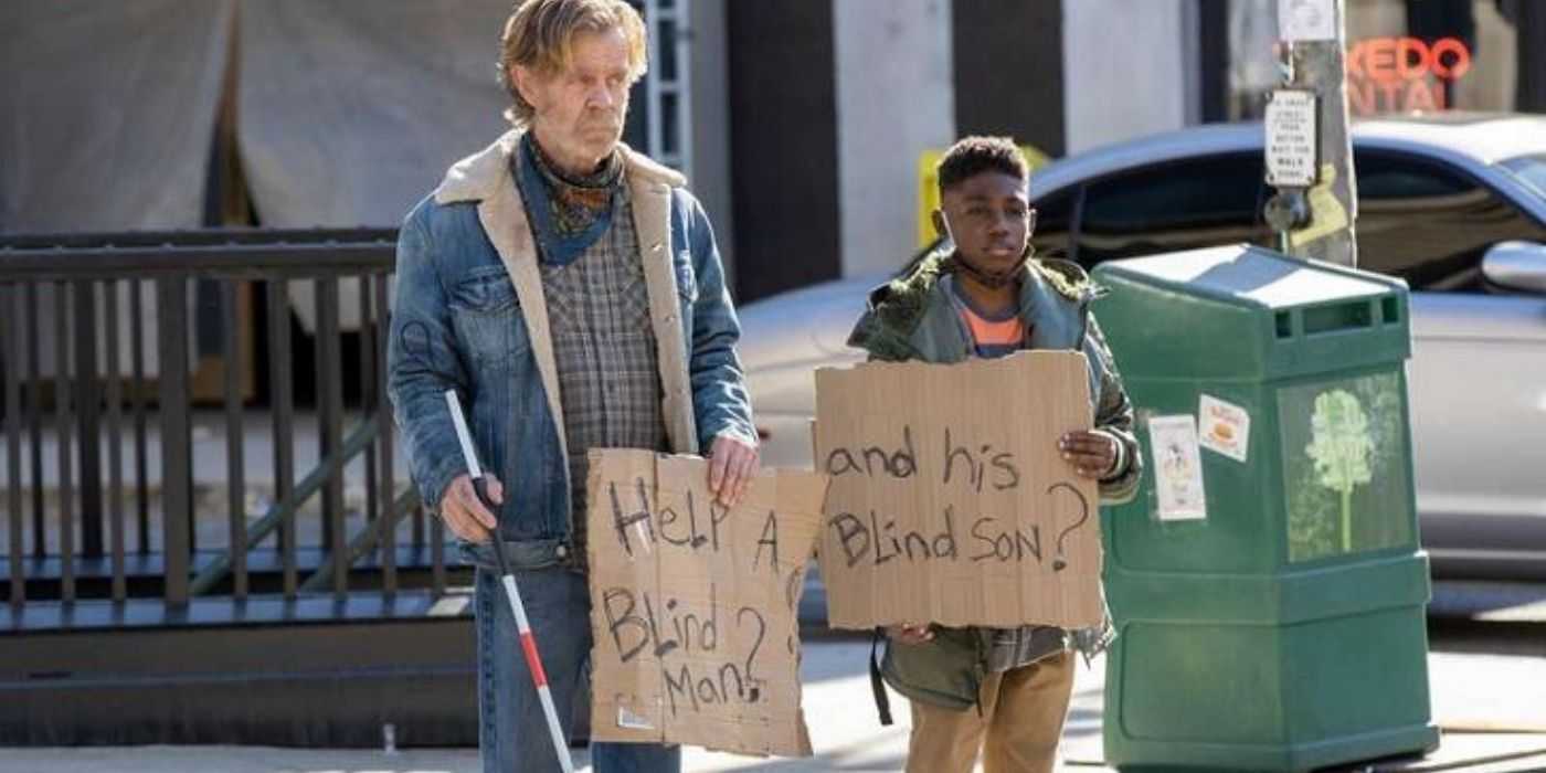 Frank and Liam begging for money on the street in Shameless.