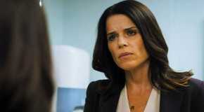 Maggie McPherson on The Lincoln Lawyer talking to a woman at the office.