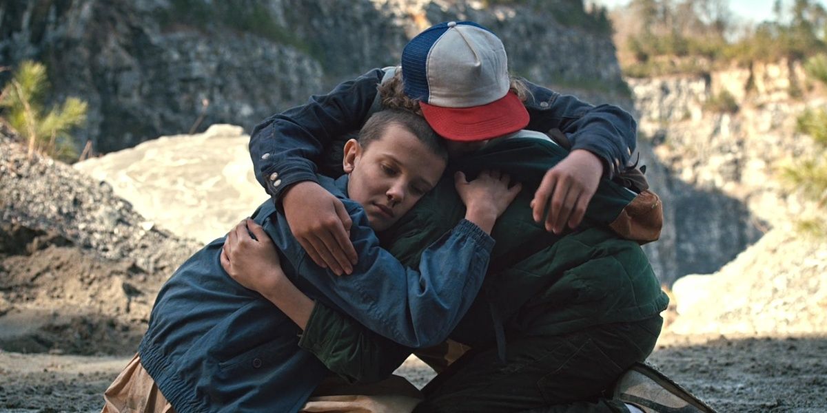 The kids in a group hug in Stranger Things Cropped