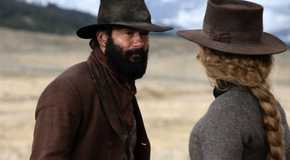 Tim McGraw as James and Faith Hill as Margaret staring at each other in 1883