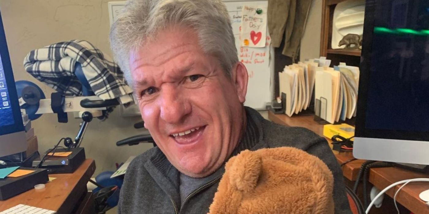 Little People Big World star MATT ROLOFF sitting in his office holding a teddy bear