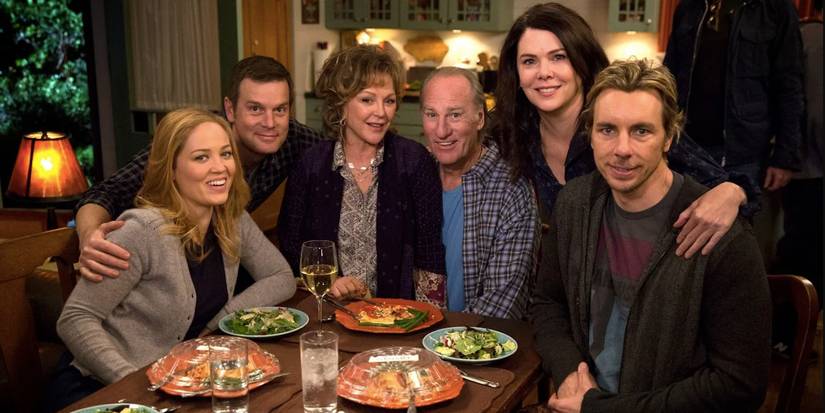 O elenco de Parenthood posa ao redor de uma mesa