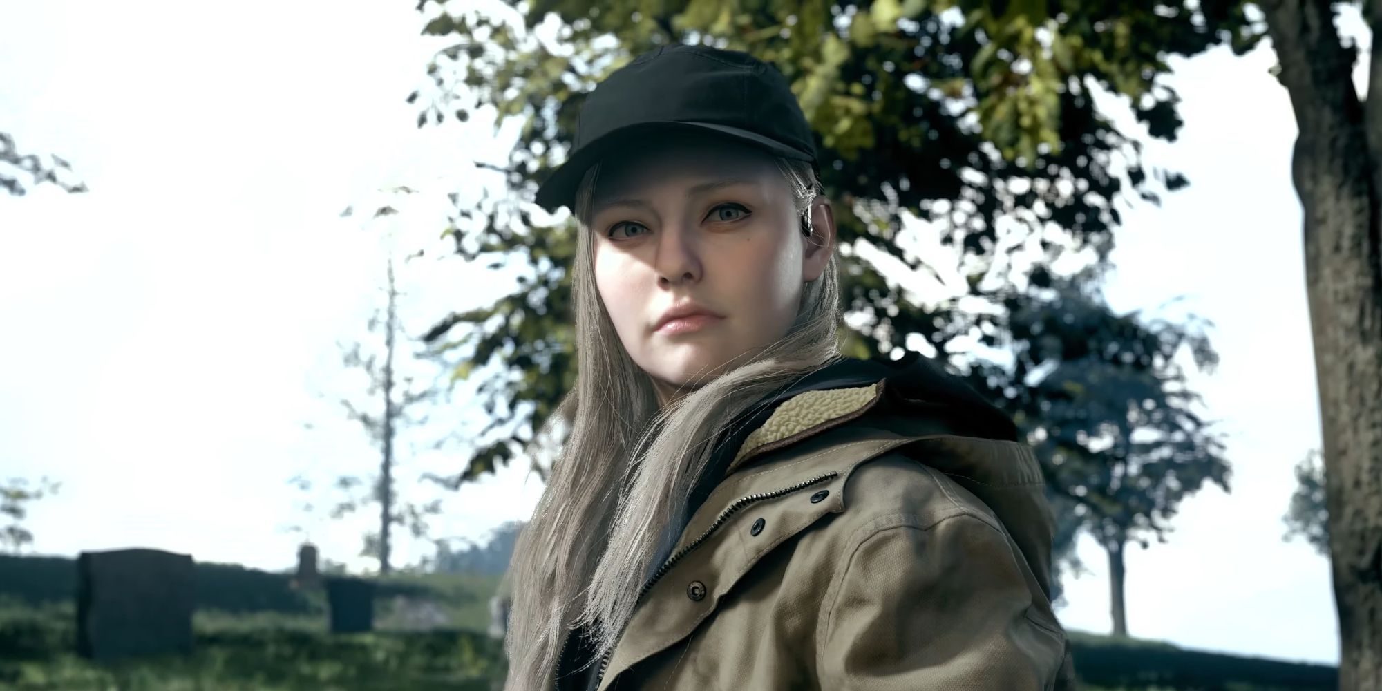 Rose is wearing a cap, coat and looks at the camera.