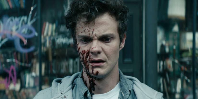 Hughie (Jack Quaid) coberto de sangue em The Boys.