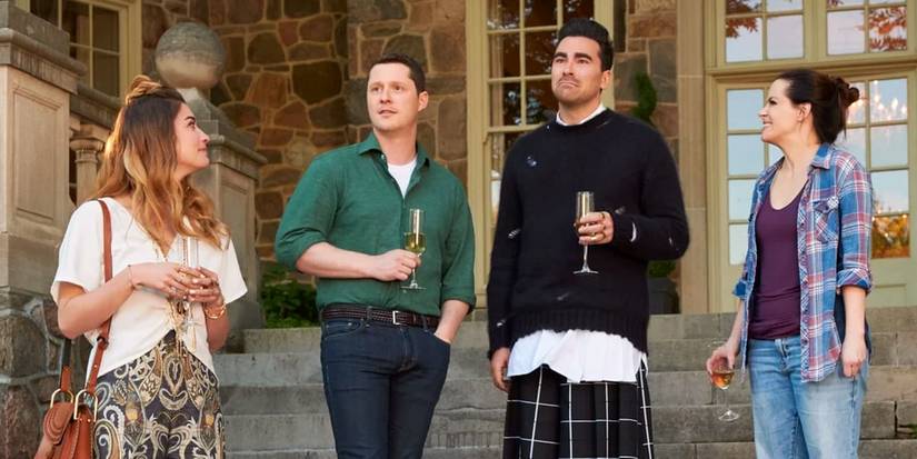 alexis patrick david and stevie in schitts creek season 6 drinking champagne