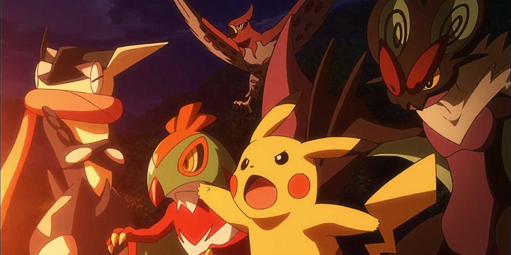 Ash's Kalos team of Greninja, Hawlucha, Talonflame, and Noivern with Pikachu pointing as something orange glows offscreen.