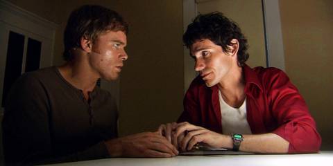 Dexter and Brian sitting together having an intimate conversation in Dexter