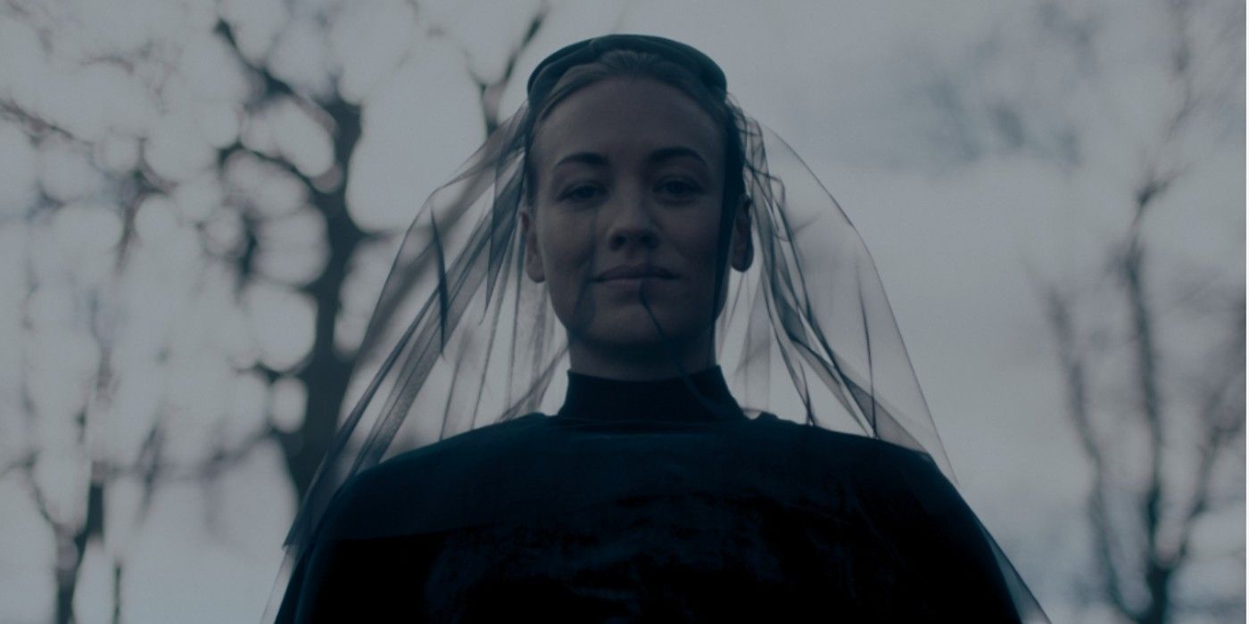 Serena Joy Waterford from The Handmaid&rsquo;s Tale dressed in black with a black veil, looking down.