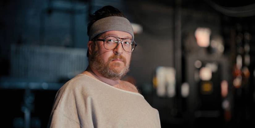 Renewal, Cast & Story Details Howard from Only Murders in the Building, is wearing a bandana and looking annoyed.