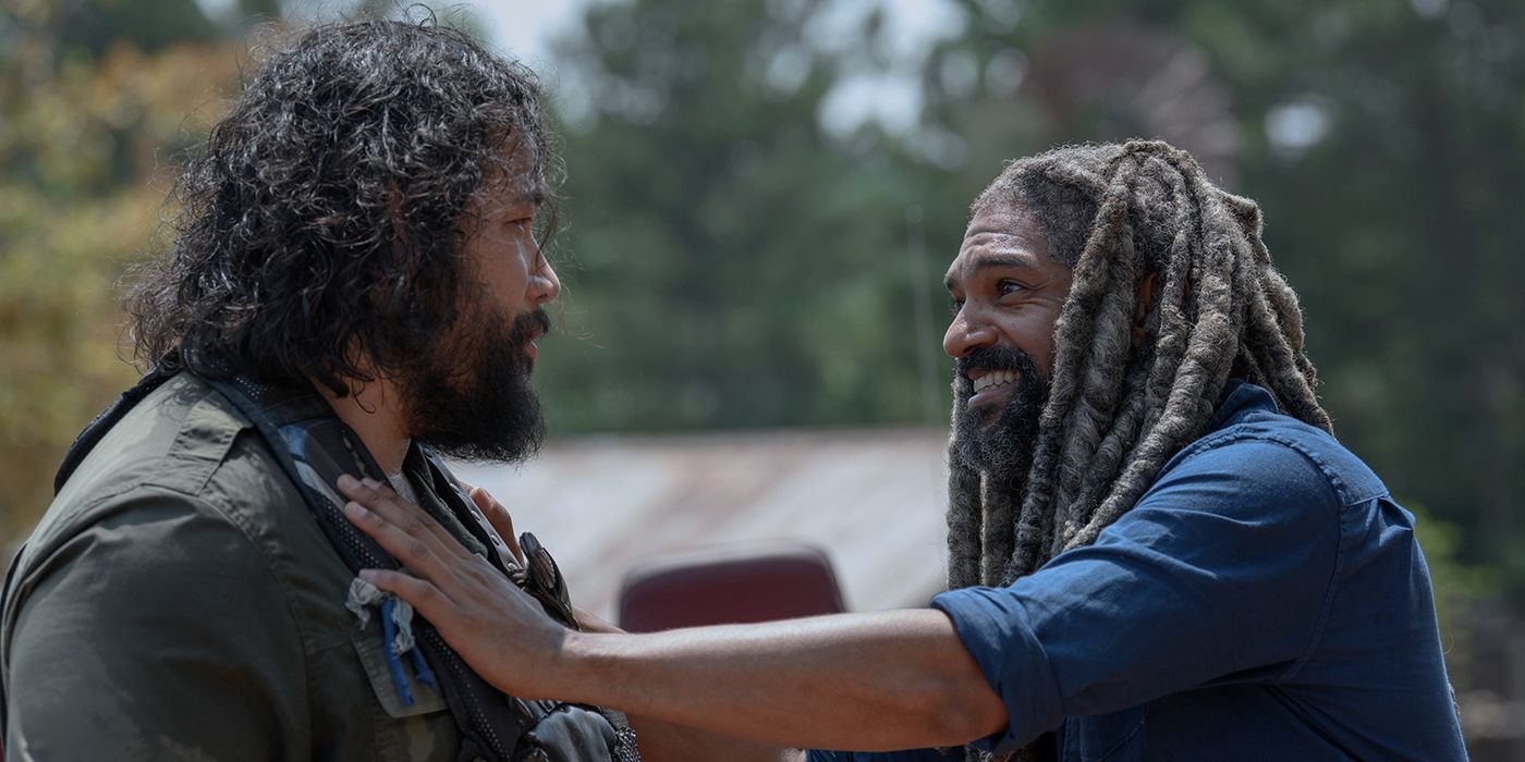 Ezekiel from The Walking Dead with his arm on Jerry's shoulder.as they smile at each other