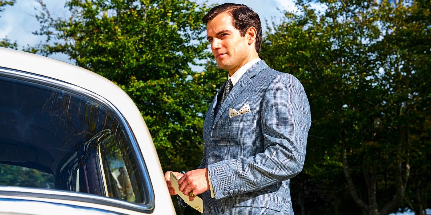 Henry Cavill in The Man From UNCLE stnding by a car