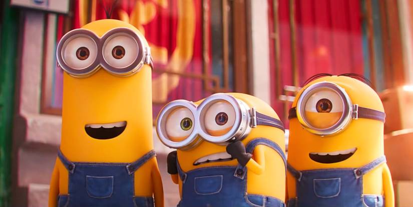 Kevin, Bob e Stuart olham com sorrisos em Minions 2: A Origem de Gru