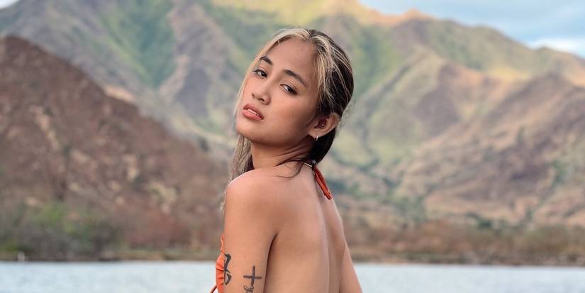 Rosemarie Rose Vega 90 Day Fiancé posing in scenic location in backless top