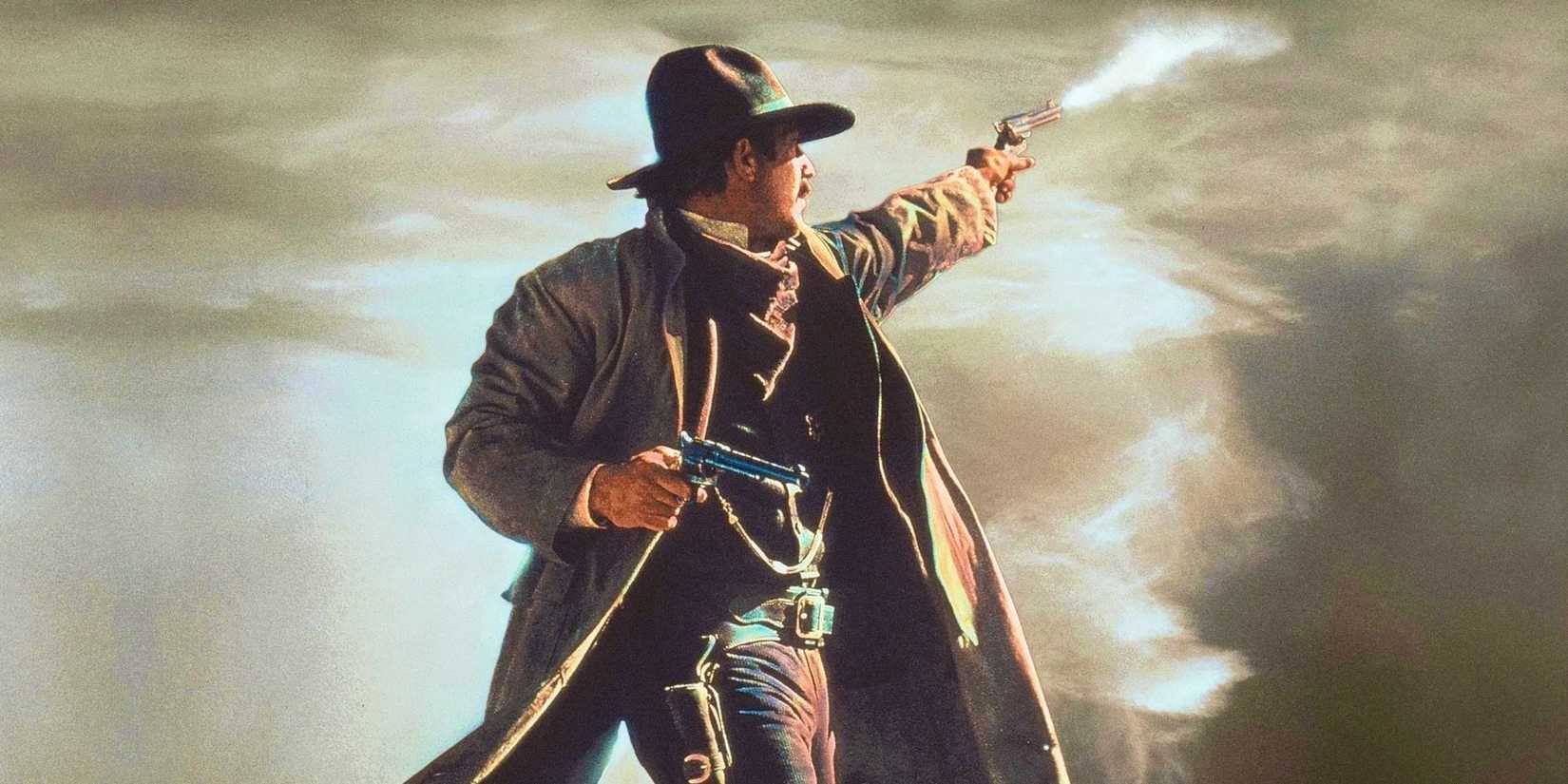 Kevin Costner as Wyatt Earp Shoots a Pistol Into the Distance in Wyatt Earp 1994