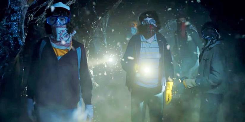 Dustin, Mike, Steve, and Lucas explore Hawkins' Upside Down tunnels in Stranger Things.