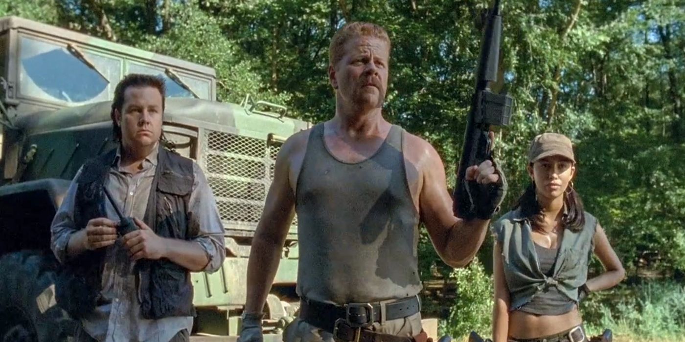 Abraham standing with Eugene and Rosita in The Walking Dead.