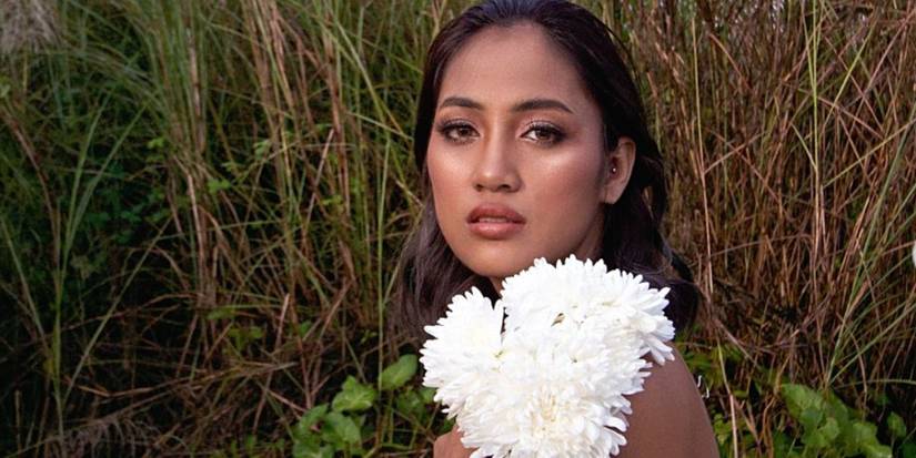 90 Day Fiancé- Rose Vega posing outdoors with flowers